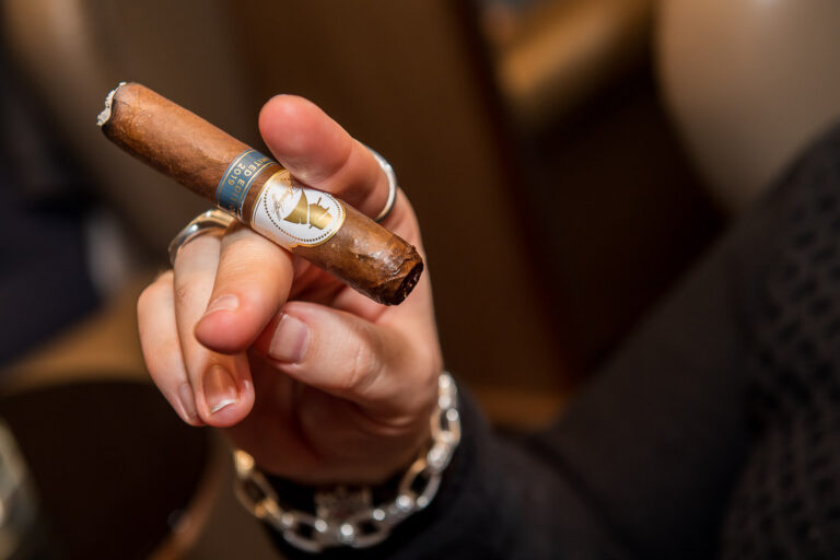 Close-up of a premium cigar at a Fine Tobacco Club event in New York